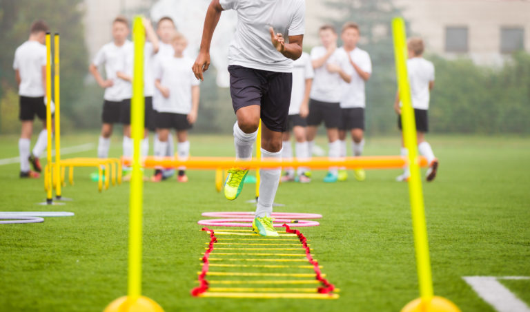 Boy Soccer Player In Training. Young Soccer Players at Practice Session