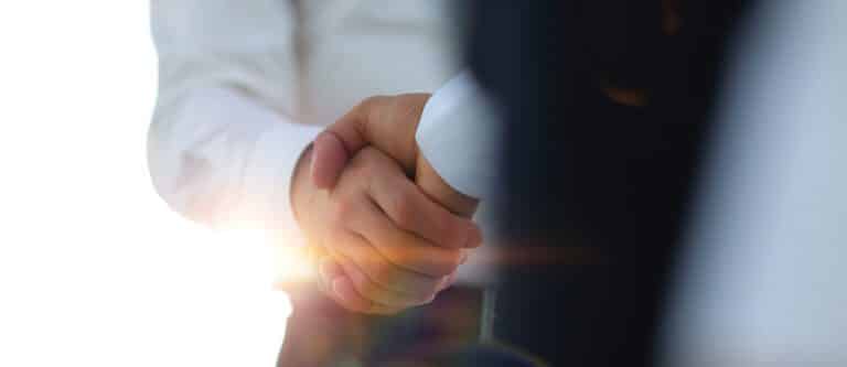 Business team partnership greeting handshake concept